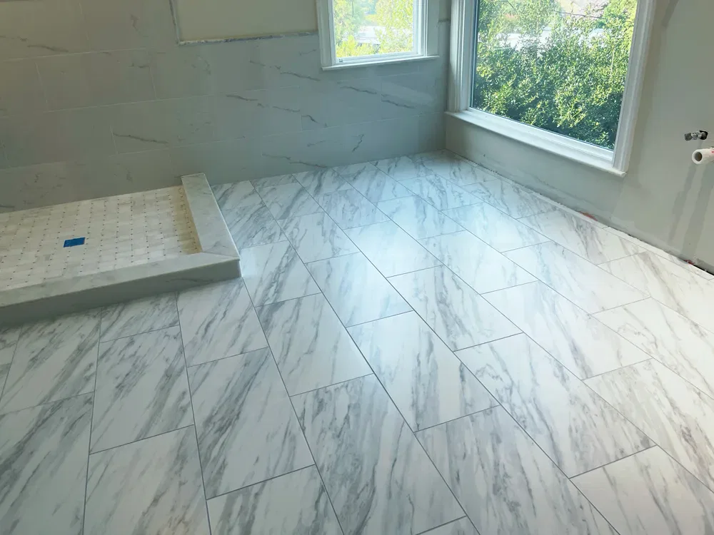 Modern bathroom with marble tiles and natural light