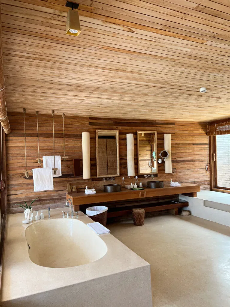 Luxurious wooden bathroom with elegant freestanding bathtub