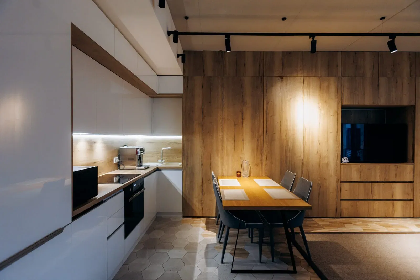 Modern kitchen with wooden accents and dining area