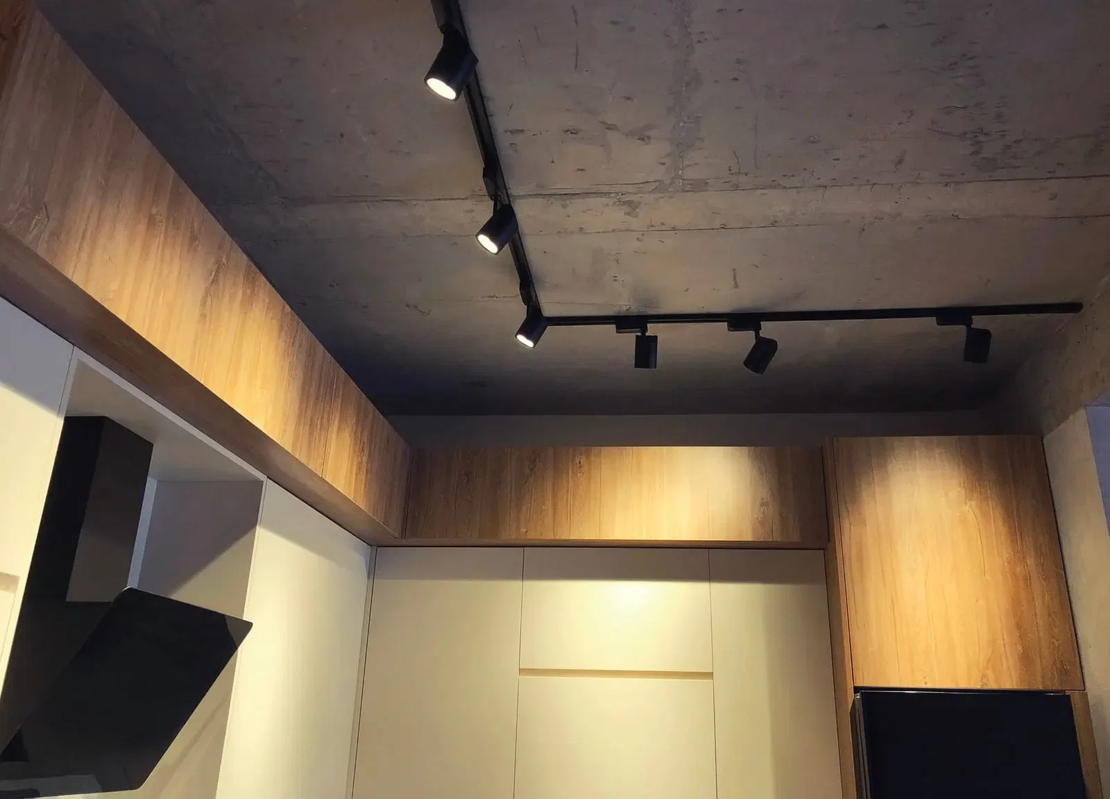 Modern interior with track lighting and wooden accents