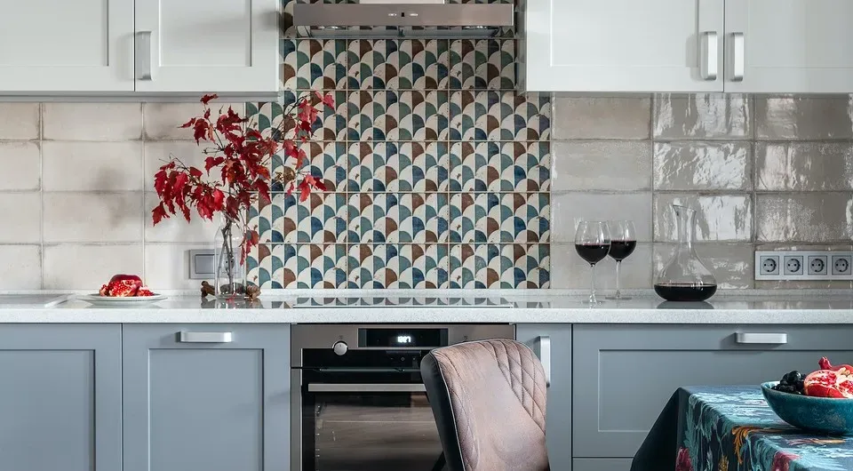 Modern kitchen with decorative tiled backsplash and wine