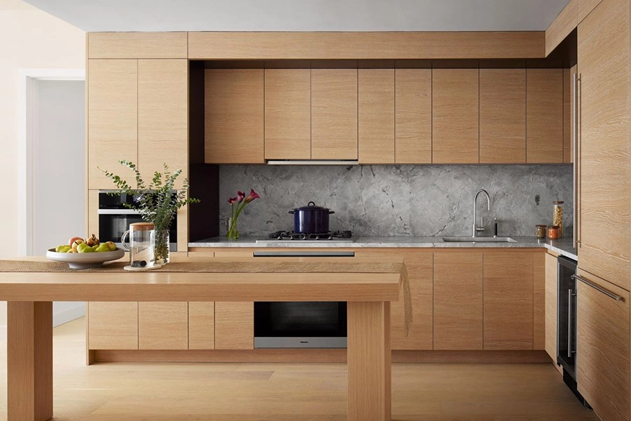 Modern kitchen with wooden cabinets and marble backsplash