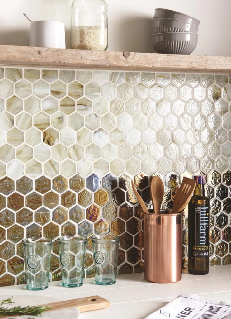 Modern kitchen with hexagonal tile backsplash and utensils